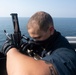 Ralph Johnson Sailor conducts gun maintenance