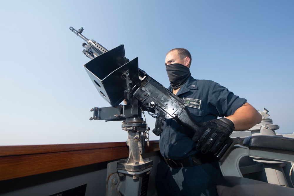 Ralph Johnson conducts gun maintenance