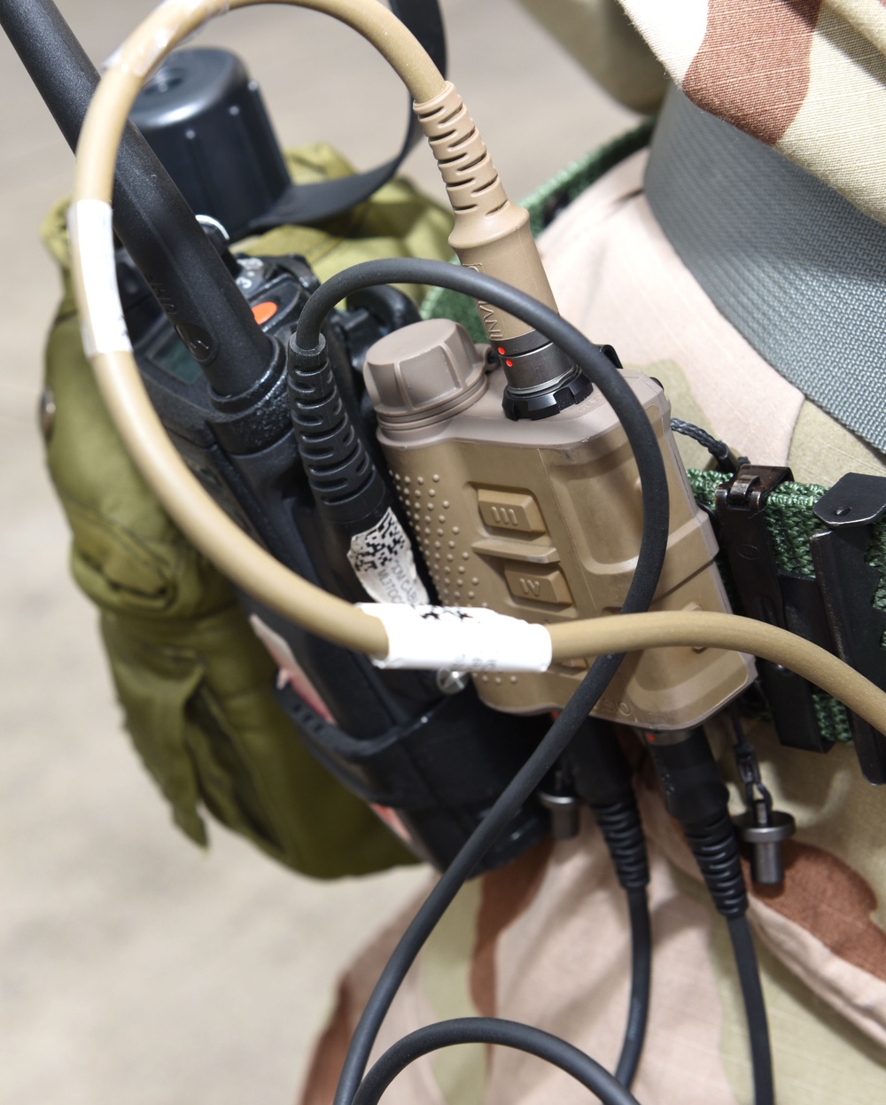 Maintainers, aircrew test in-ear headset during CBRN exercise