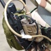 Maintainers, aircrew test in-ear headset during CBRN exercise