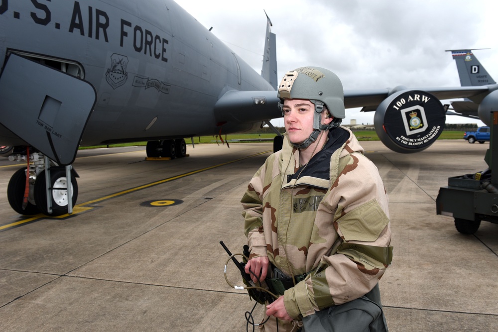 Maintainers, aircrew test in-ear headset during CBRN exercise