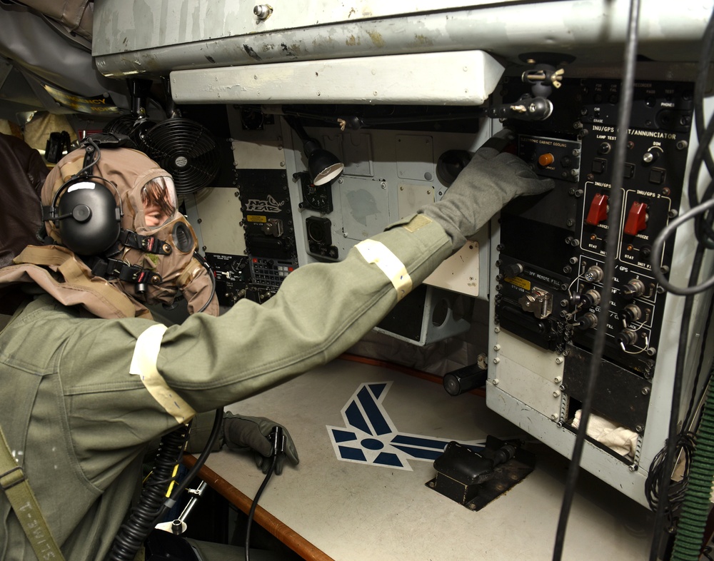 Maintainers, aircrew test in-ear headset during CBRN exercise