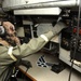 Maintainers, aircrew test in-ear headset during CBRN exercise