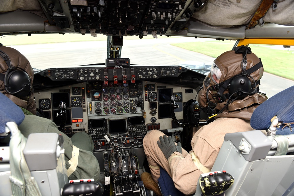 Maintainers, aircrew test in-ear headset during CBRN exercise