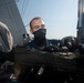 Ralph Johnson Sailor conducts gun maintenance