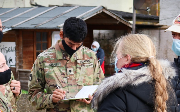 Iowa Soldiers interact with civilian role players at JMRC