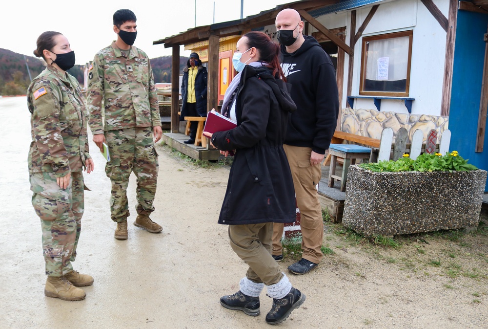 Iowa Soldiers interact with civilian role players at JMRC