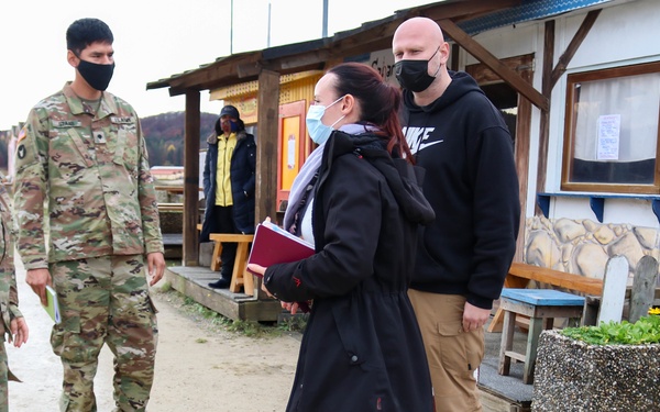 Iowa Soldiers interact with civilian role players at JMRC