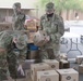 Arizona National Guard members load food into local residents vehicles from local food banks.