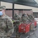 Arizona National Guard members load food into local residents vehicles from local food banks.