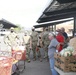 Arizona National Guard members load food into local residents vehicles from local food banks.