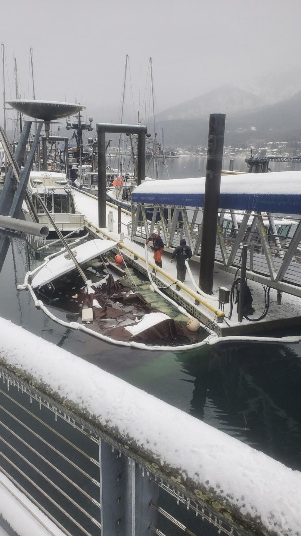 Coast Guard, local agencies respond to sunken docked vessel
