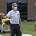 CAPT Ewing and CMC McDermott watch as Sailors receive DECON Training