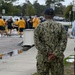 CAPT Ewing and CMC McDermott watch as Sailors receive DECON Training