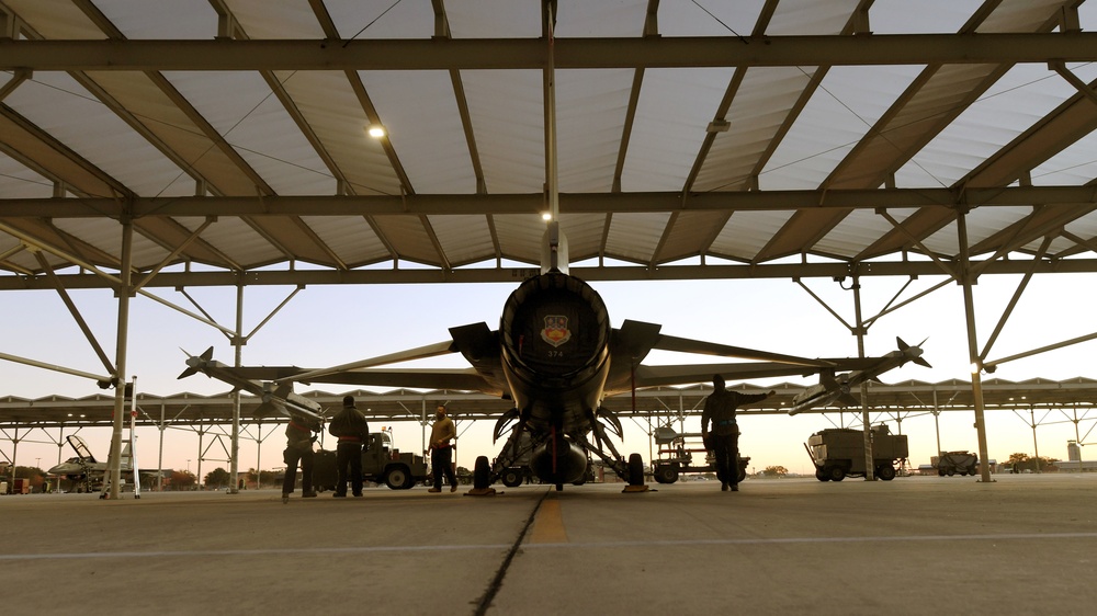 Weapon loaders prepare F-16