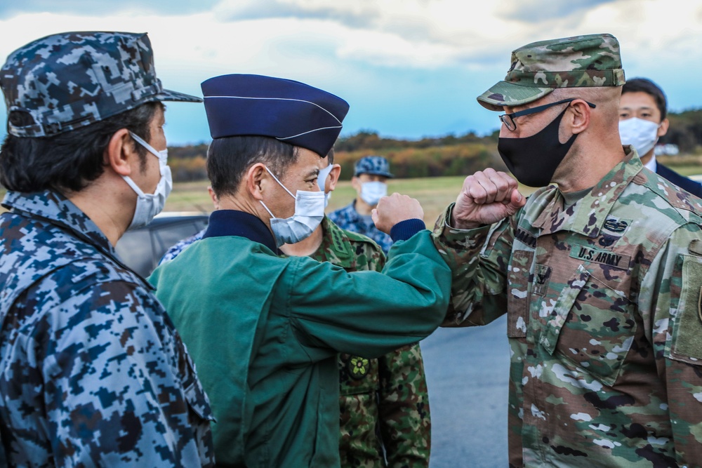 Col. Matthew W. Dalton greets Gen. Shuji Izutsu