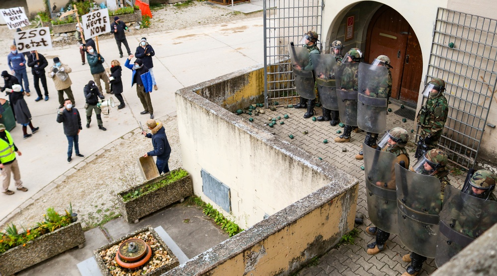 Albanian Armed Forces members respond to mock protest at JMRC in multinational training event