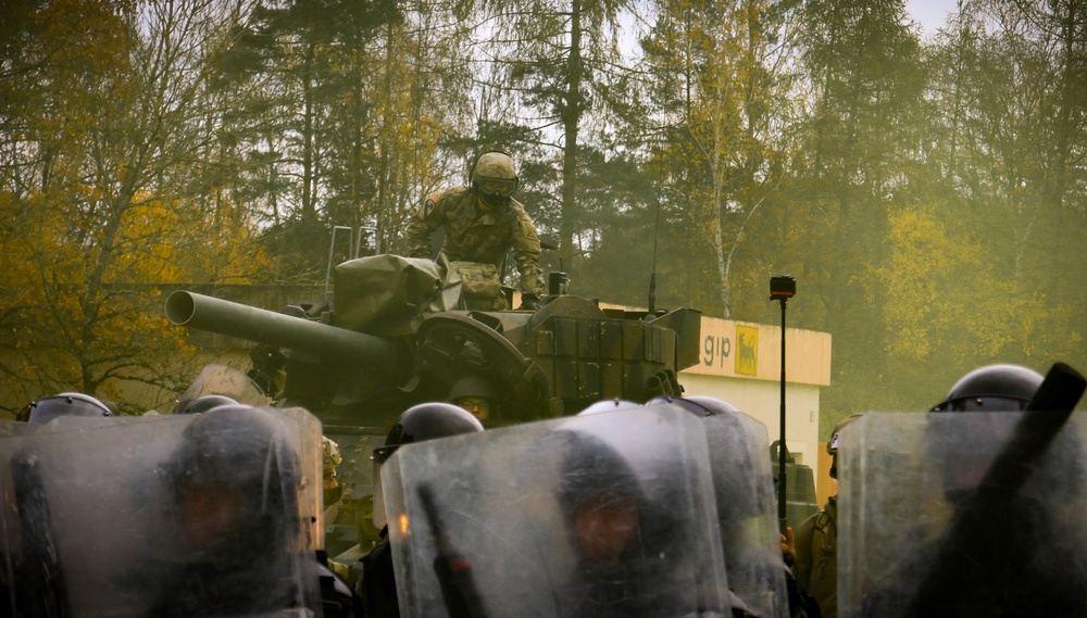 U.S. Army Soldier responds to mock protest at JMRC in multinational training event