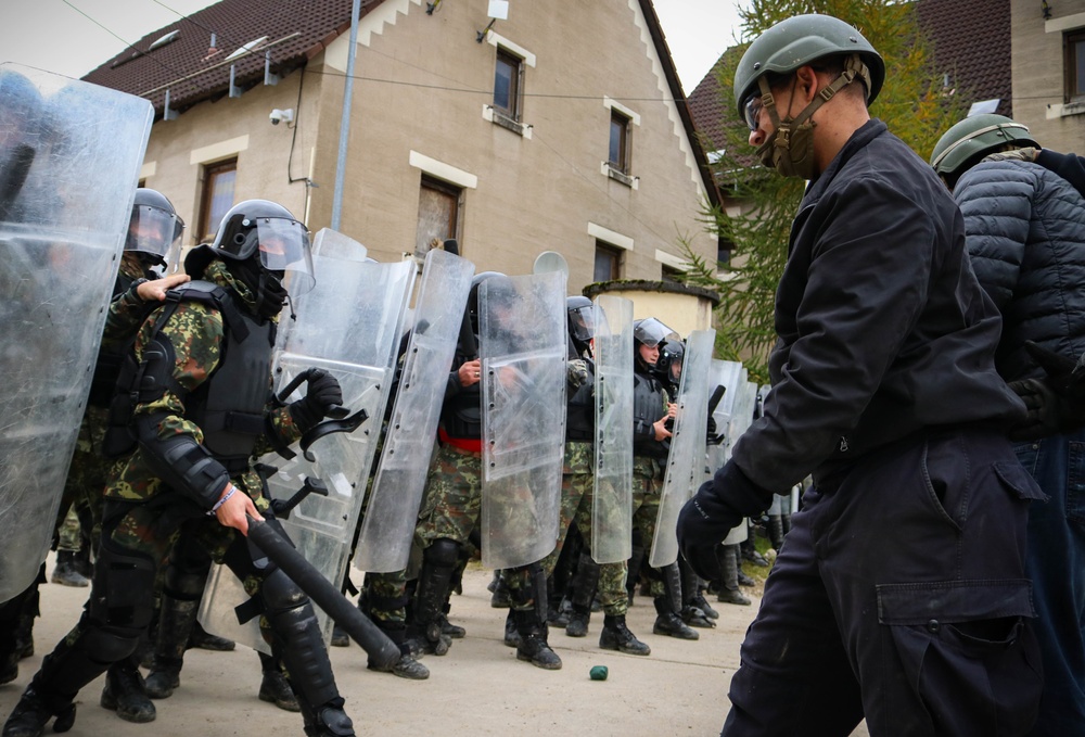 Albanian Armed Forces members respond to mock protest at JMRC in multinational training event