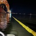 Responders cover mooring lines with heavy-duty anti-chafing covers