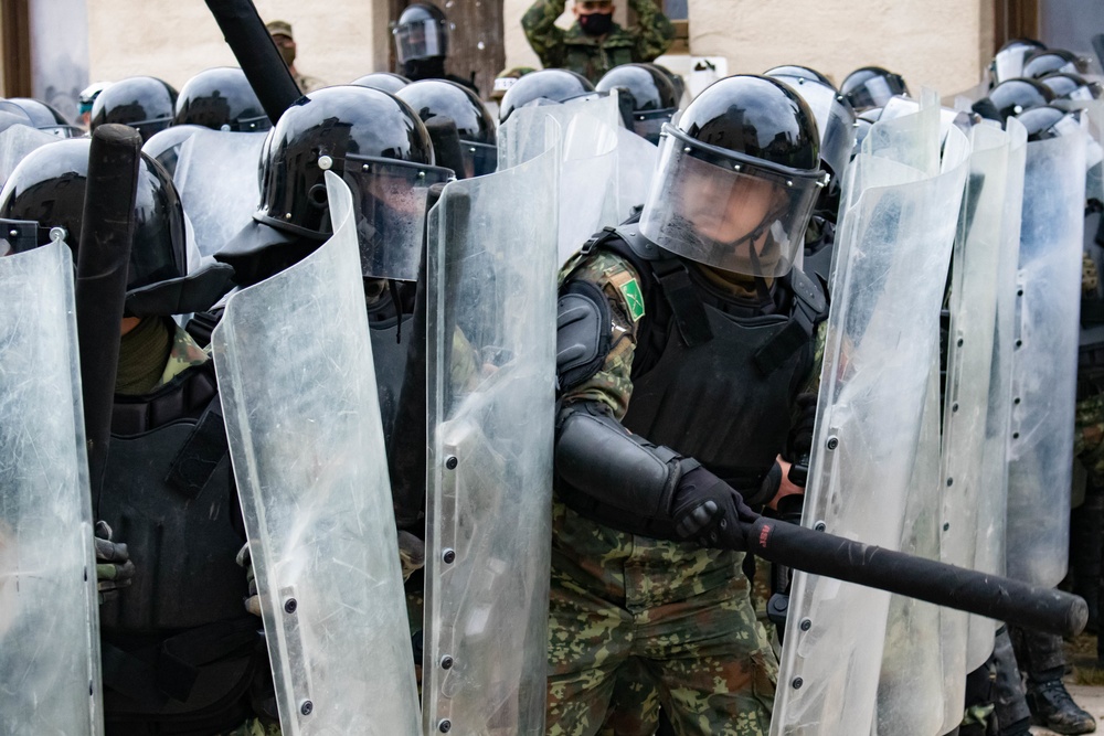 Riot control team pushes forward