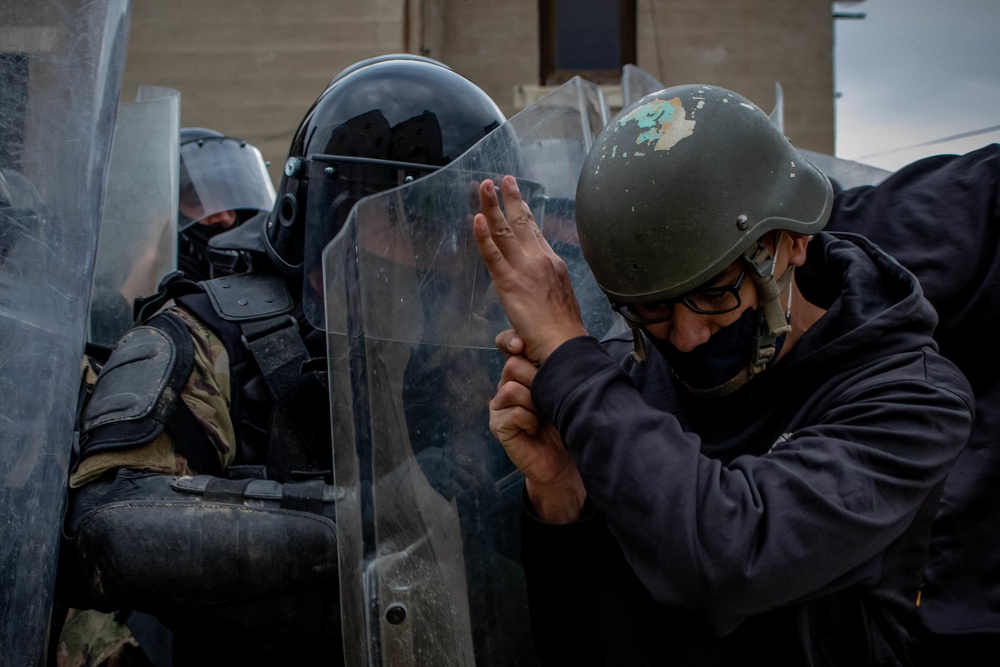 Albanian Armed Forces and simulated opposing forces collide during crowd riot control training