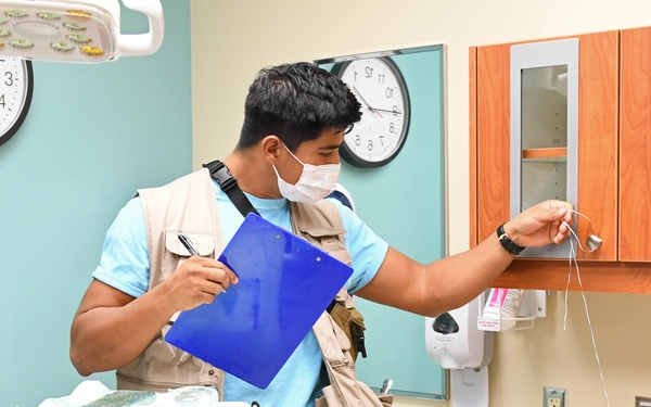 Sailor observes and records patient safety errors in the 'Room of Errors' at BHC Kaneohe Bay