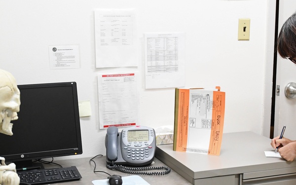 Naval Health Clinic Hawaii (NHCH) Lab Technician records patient safety errors in the 'Room of Errors' at Branch Health Clinic (BHC) Makalapa