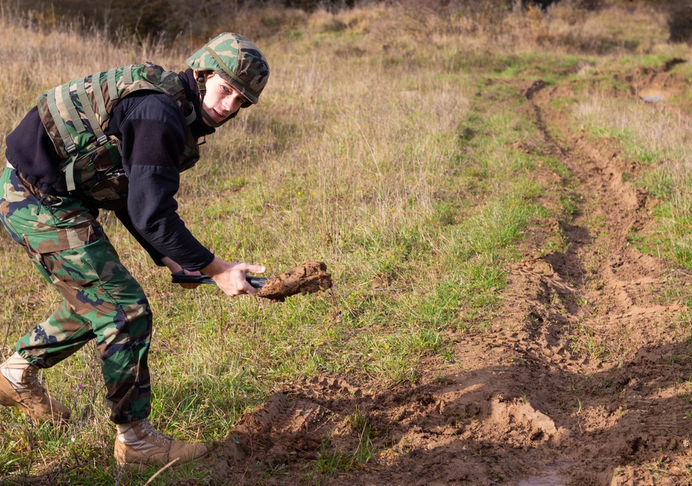 A Moldovan soldier conducts UXO training