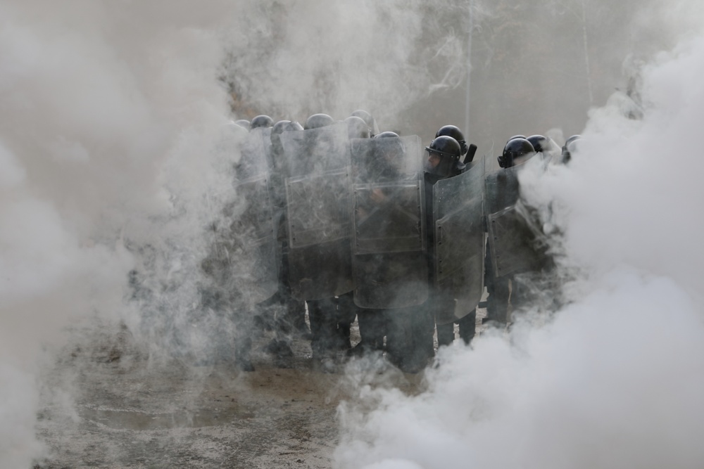 Albanians and US troops engage in mock protest