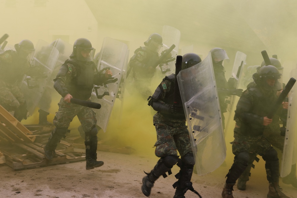 Albanians and US troops engage in mock protest