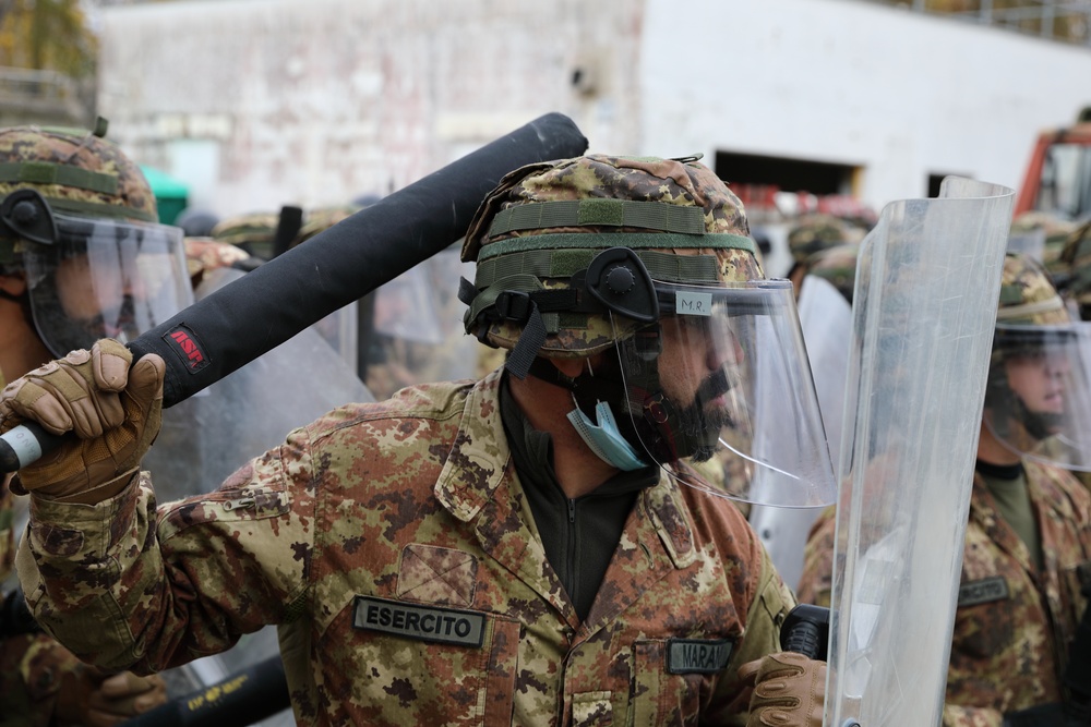 Italian and US troops engage in mock protest