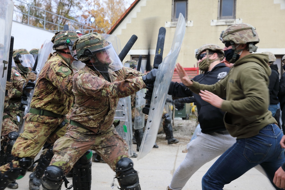 Italian and US troops engage in mock protest