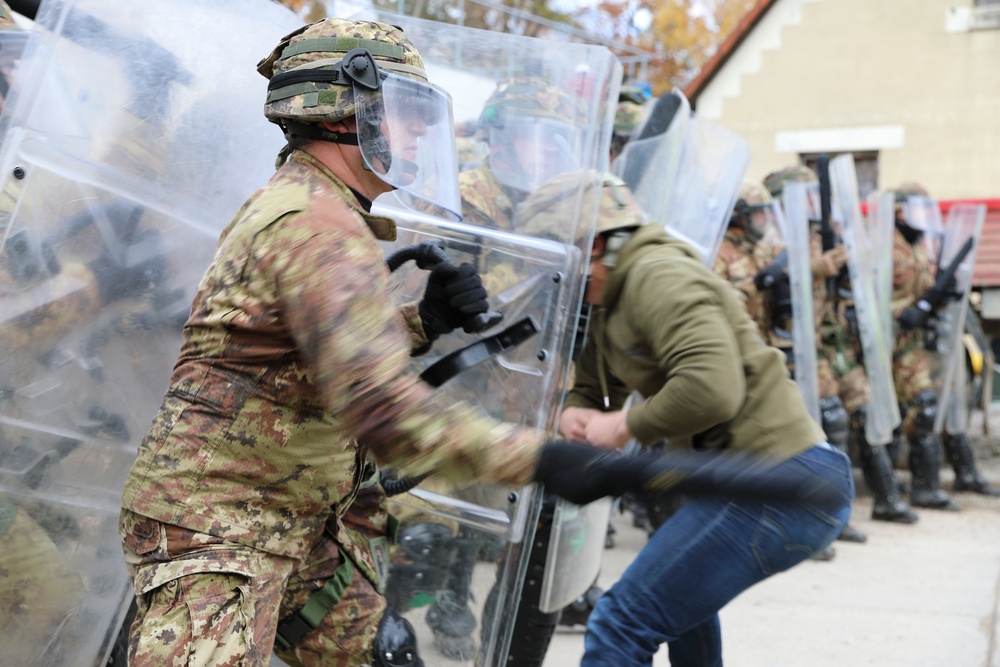 Italian and US troops engage in mock protest
