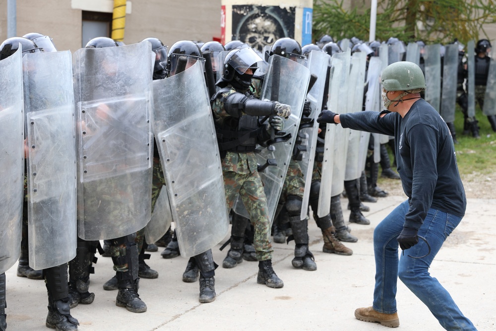 Albanians and US troops engage in mock protest