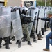 Albanians and US troops engage in mock protest