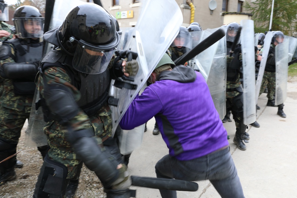 Albanians and US troops engage in mock protest