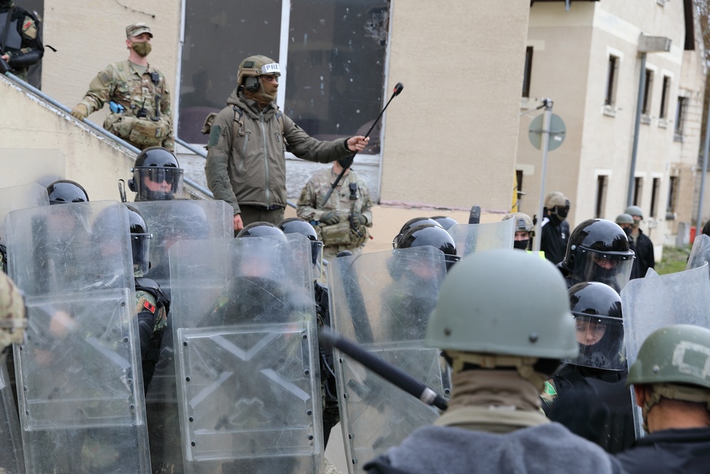 Albanians and US troops engage in mock protest