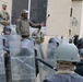 Albanians and US troops engage in mock protest