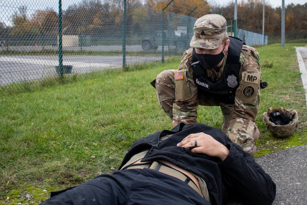Soldier gives care to simulated patient