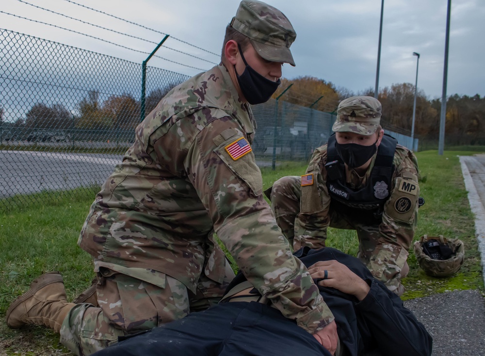 Soldier provides aid to simulated casualty