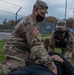 Soldier provides aid to simulated casualty