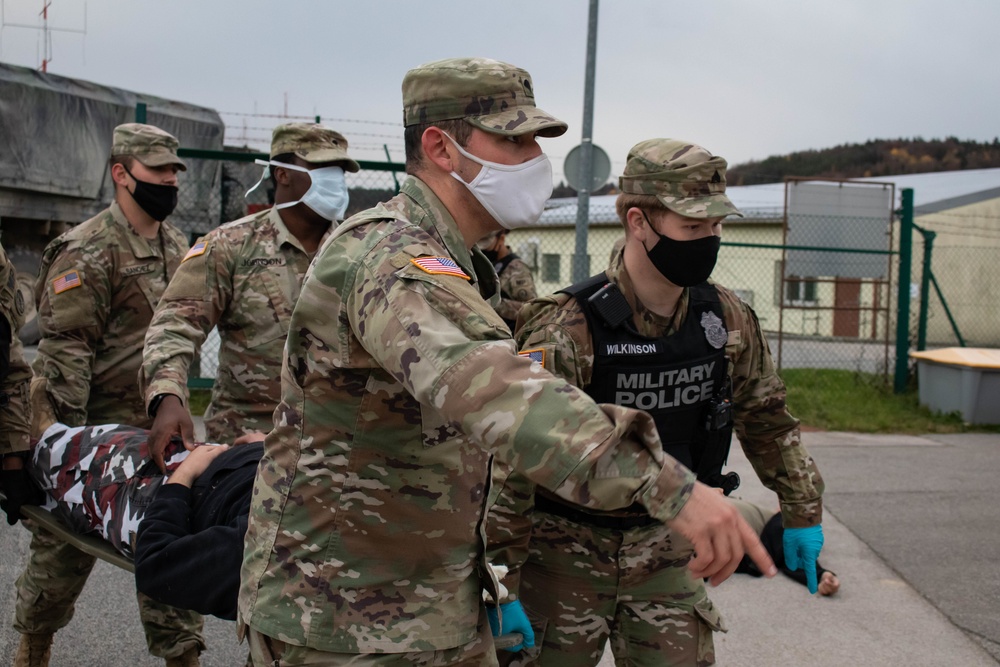 Soldiers provide aid to simulated casualty