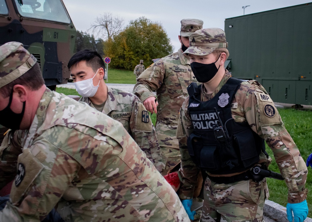 Soldiers provide aid to simulated casualty