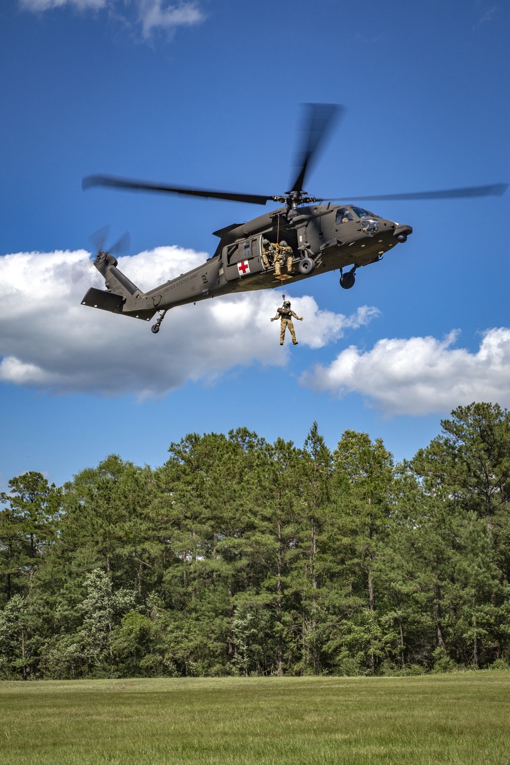 USAARL's UH-60M Black Hawk helicopter performing dynamic hoist operations