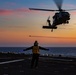 15th MEU Marines fast-rope from a helicopter onto USS Makin Island