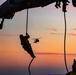 15th MEU Marines fast-rope from a helicopter onto USS Makin Island