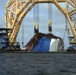 Anchor chain attached to the pulley system on the VB-10000 heavy-lift vessel moves slowly to cut through Section One of the Golden Ray wreck