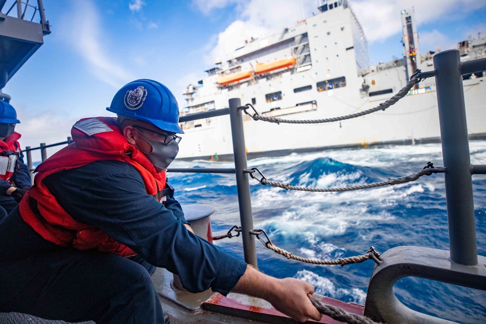 Sailor Heaves a Line During Replenishment-At-Sea