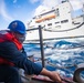 Sailor Heaves a Line During Replenishment-At-Sea